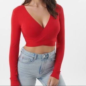 pink long sleeve cross cross crop top